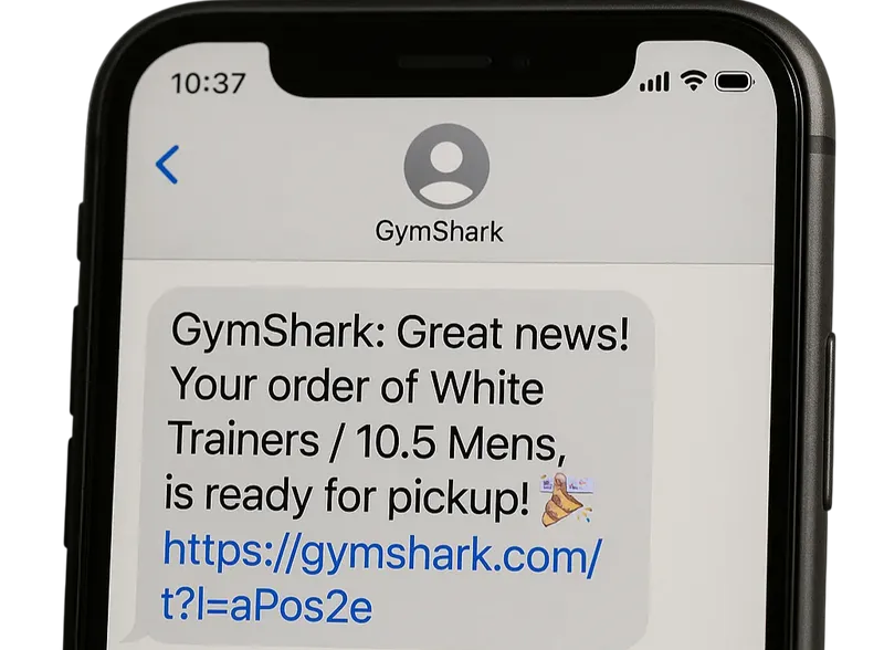 Phone screen displaying a text message from "GymShark" stating, "Great news! Your order of White Trainers / 10.5 Mens is ready for pickup!" followed by a link.